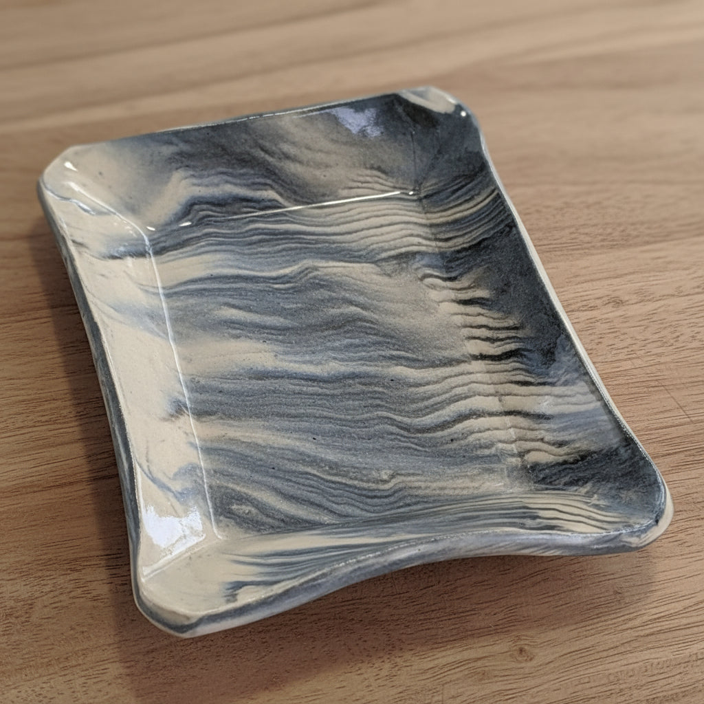 Marbled ceramic dish on a white background
